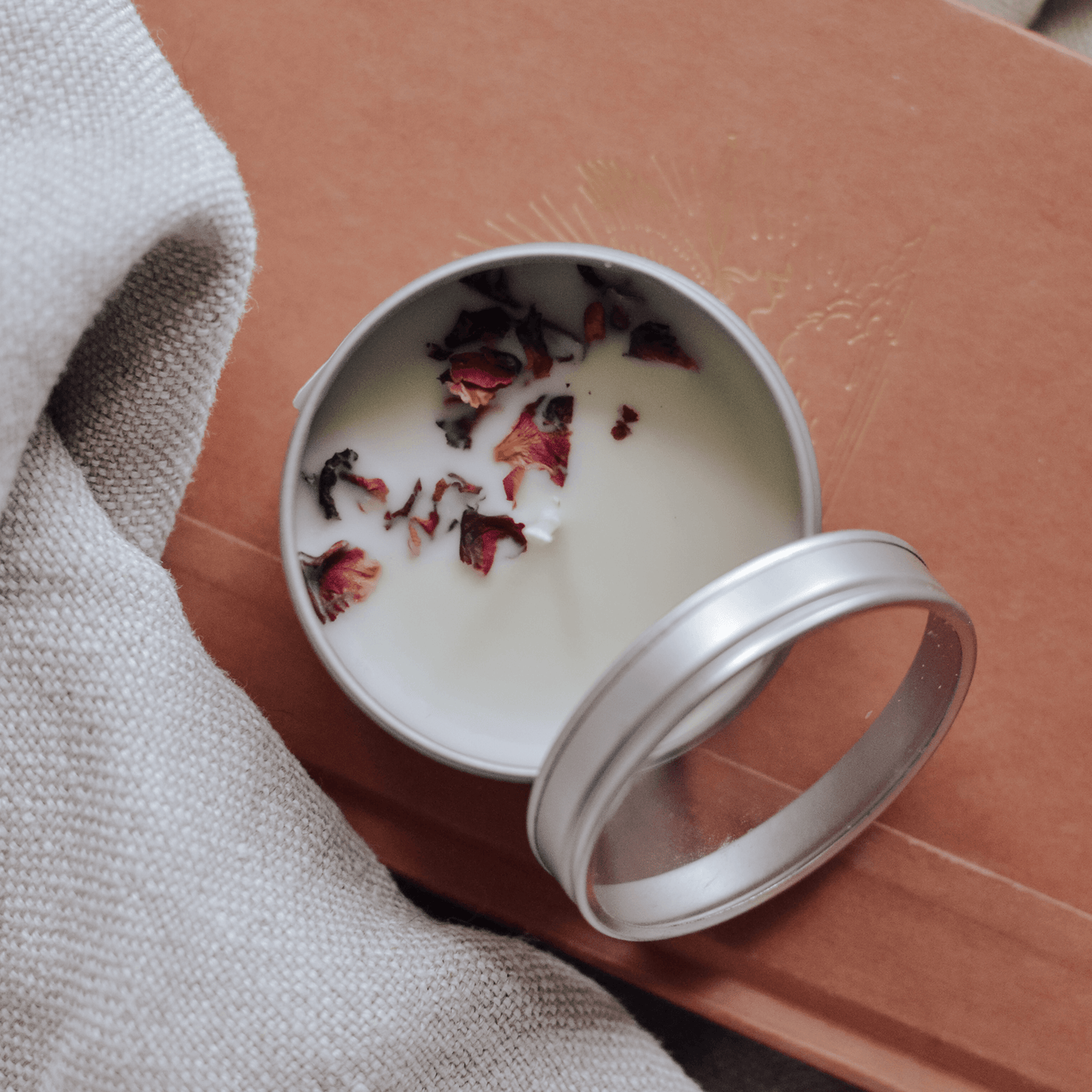 Wildrose cranberry handmade soy candle with lid.